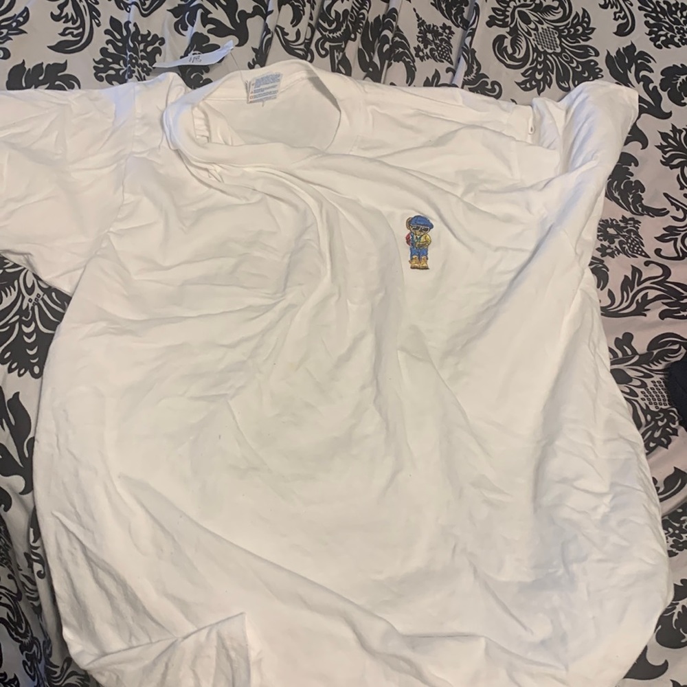 White shirt with lil bear on it